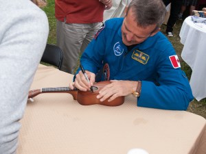 Cmdr. Chris Hadfield autographing my ukulele.
